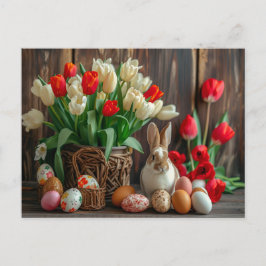 Easter bunny seated beside colorful eggs and tulip postkarte