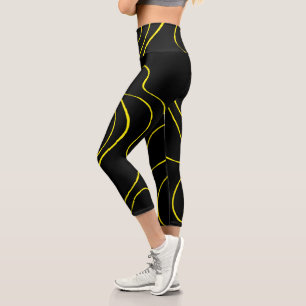 Ebbe und Flut 2 in Schwarz und Gelb Capri Leggings