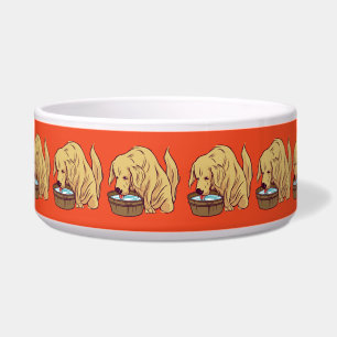 Écuelle Retriever doré drôle buvant de l'eau