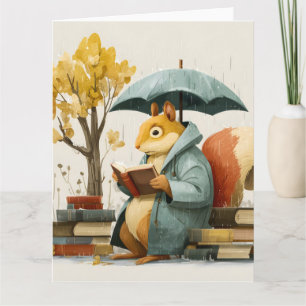 Eichhörnchen liest Bücher unter einem Regenschirm Karte