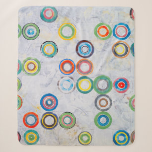 Ein abstraktes Bild; farbige Kreise auf einem Gr Sherpadecke
