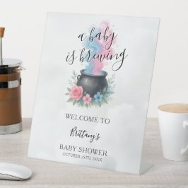 Ein Baby brütet Geschlecht und begrüßt Sockelschild