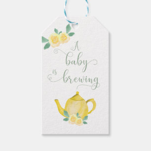 Ein Baby wird gelbe Teekanne mit Blumenbeet, Babyd Geschenkanhänger