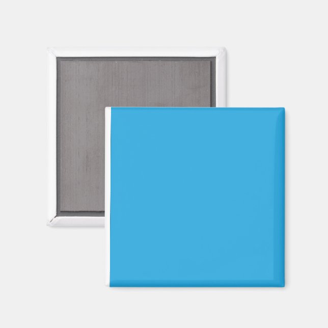 ein blauer Hintergrund mit einer schwarz-weißen Ka Magnet (Vorderseite/Rückseite)