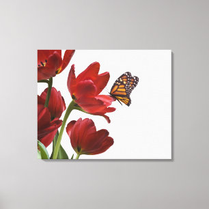 ein Blumenstrauß der roten Tulpen wird von einem Leinwanddruck
