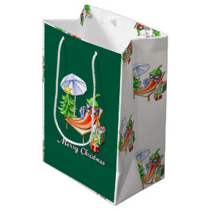 Ein Chili frohe Weihnachten unter Sonnenschirm und Mittlere Geschenktüte