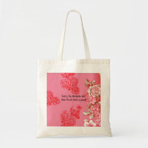 Ein elegantes Blumenarrangement in Rosa und Gold. Tragetasche