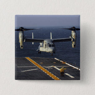 Ein Flugzeug des Osprey V-22 bereitet vor sich zu Button