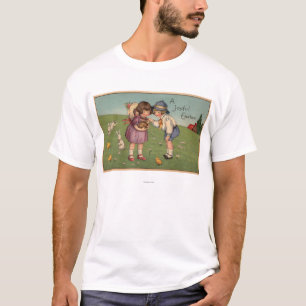 Ein frohes EasterKids, das ein Häschen hält T-Shirt