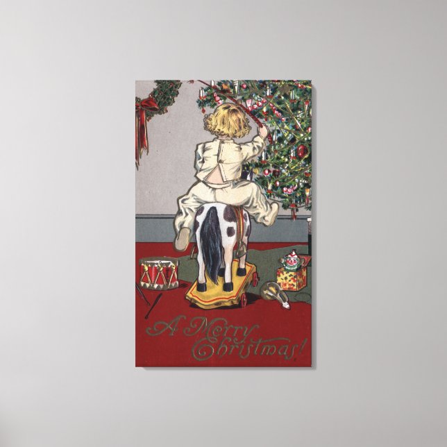 Ein frohes Weihnachtskid auf einem Rockpferd Leinwanddruck (Vorderseite)