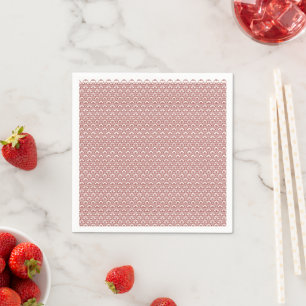 Ein gemusterter Teppich mit roten und braunen Moti Serviette
