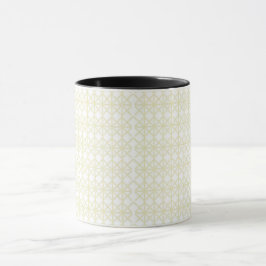 ein geometrisches Muster aus weiß und gold Tasse