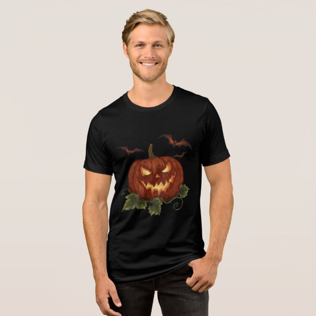 Ein großer Kürbis mit leuchtenden Augen und Fleder Tri-Blend Shirt (Vorderseite voll)