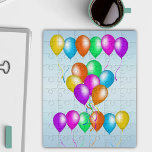 Ein Haufen heller, festlicher Balloons streamers B Puzzle<br><div class="desc">Dieses Puzzle aus Acryljig hat einen Haufen heller festlicher Ballons,  die verstreut sind. Sie sind in einer Vielzahl von Farben und haben passende Bänder auf einem hellblauen Hintergrund.</div>