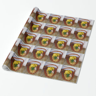 Ein Körbchen mit gelben Eizellen und blumengeschmü Geschenkpapier