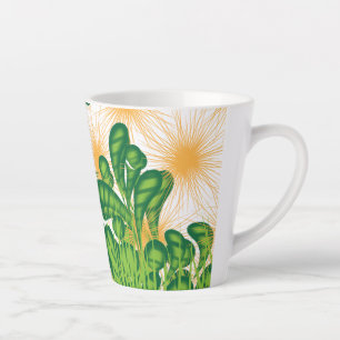 Ein künstlerisches Muster in Grün und Gold, das ei Milchtasse