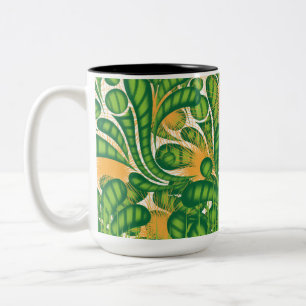 Ein künstlerisches Muster in Grün und Gold, das ei Zweifarbige Tasse