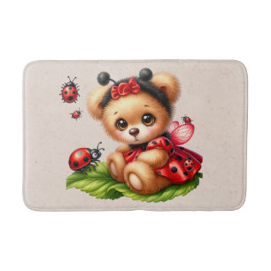 Ein Niedlicher Teddybär, verkleidet wie ein Ladybu Badematte