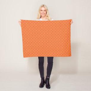 ein orangefarbener und gelber Hintergrund mit klei Fleecedecke