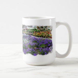 Ein örtliches Greenhouse zeigt ihre Gewinne Kaffeetasse