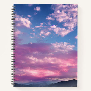 Ein rosa leuchtender Sonnenaufgang Notizbuch