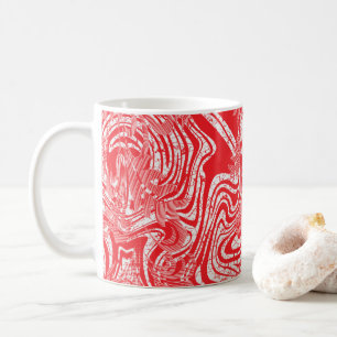 ein rot-weißes Bild eines Musters auf einem weißen Kaffeetasse
