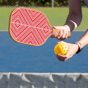 ein roter und weißer Hintergrund mit einem Diamant Pickleball Schläger