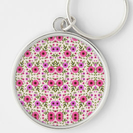 Ein runder Schlüsselanhänger mit farbenfrohem flor