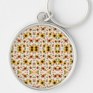 Ein runder Schlüsselanhänger mit floralem Mosaikde