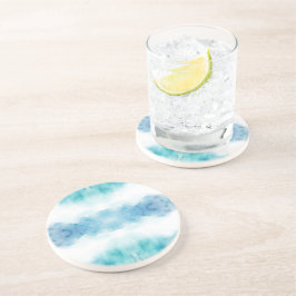Ein runder Teller mit einem Wasserfarben-Design Getränkeuntersetzer