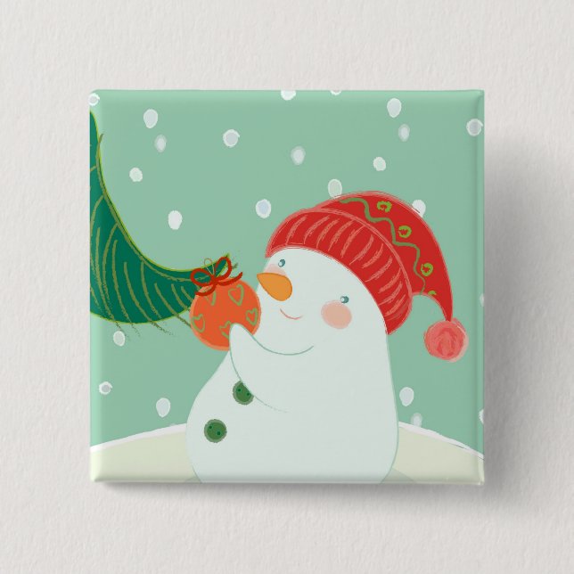 Ein Schneemann, der eine Verzierung auf einem Baum Button (Vorderseite)