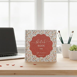 Ein Skizzenbuch mit floralen Designs Notizbuch