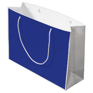 Ein solider blauer Hintergrund ohne sichtbares Ele Große Geschenktüte