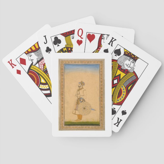 Ein stehender Offizier, mit Schwert und Schild vor Spielkarten (Rückseite)