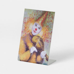Ein süßer Clown, der Geige spielt Sockelschild