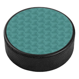 Ein Türkis geometrisches Muster ziert die Oberseit Eishockey Puck