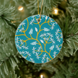Ein türkisrundes Ornament mit goldenen Reben und W