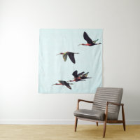 Ein Wedge von Ibises im Flug