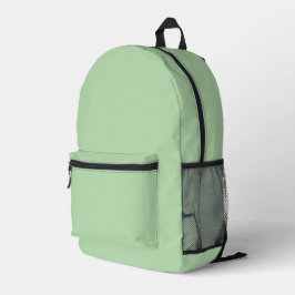 Ein weicher, blassgrüner Hintergrund füllt das Bil Bedruckter Rucksack