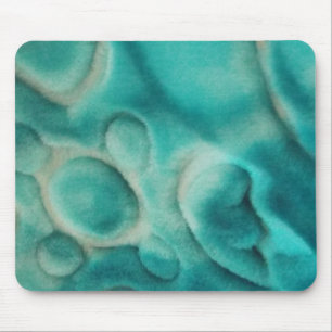 Ein wirbelndes Muster in aquamarin und hellbeige Mousepad