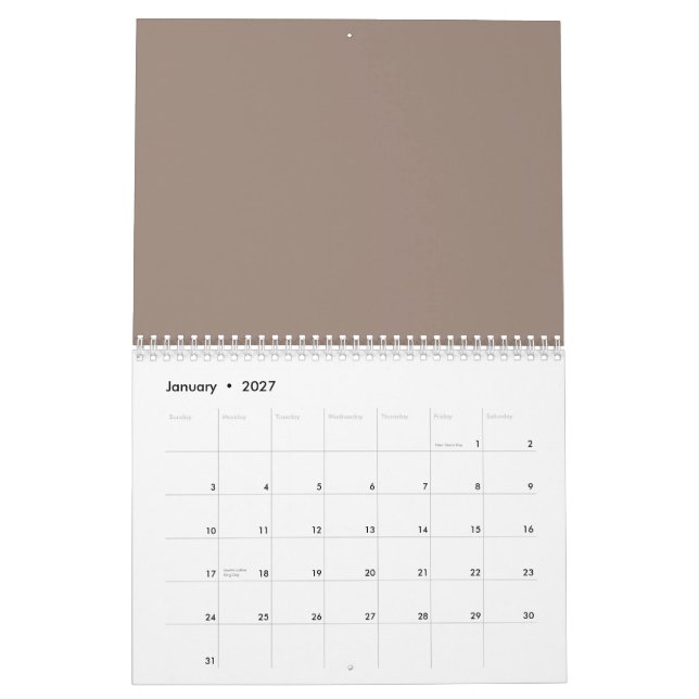 eine braune Mauer mit einer Uhr darauf Kalender (Jan 2027)
