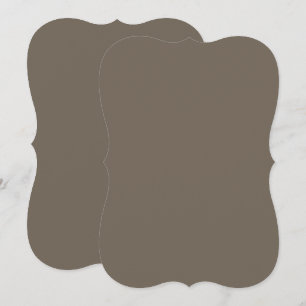 eine braune Wand mit einer schwarz-weißen Uhr