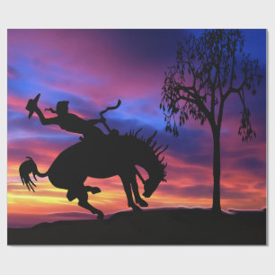 Eine Cowboy-Silhouette am Sonnenuntergang Geschenkpapier