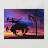 Eine Cowboy-Silhouette bei Sonnenuntergang