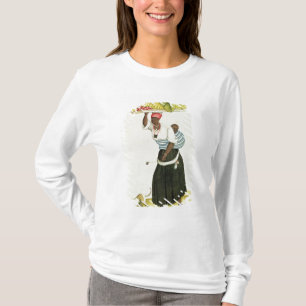 Eine Frau, die einen Behälter der Frucht auf ihre T-Shirt
