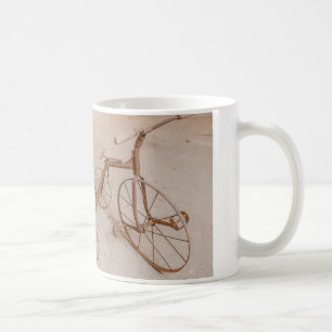 eine Kaffeetasse mit einem Foto eines alten Dreira