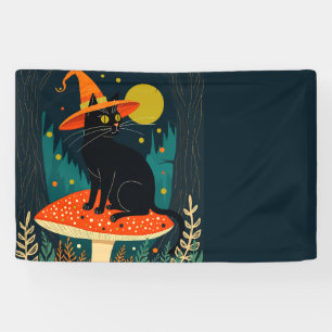 Eine kleine schwarze Hexenkatze sitzt auf einem Fl Banner