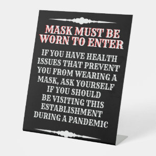 Eine Maske tragen Sockelschild