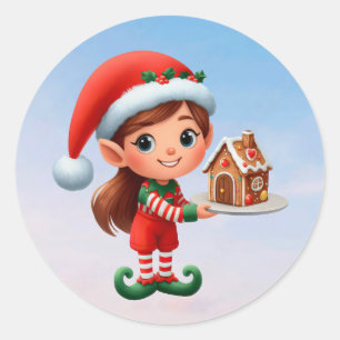 Eine niedliche Elf, die ein Lebkuchenhaus hält Runder Aufkleber