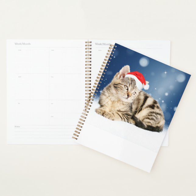 Eine Niedliche Katze, die einen Weihnachtsschnee i Planer (Anzeige)